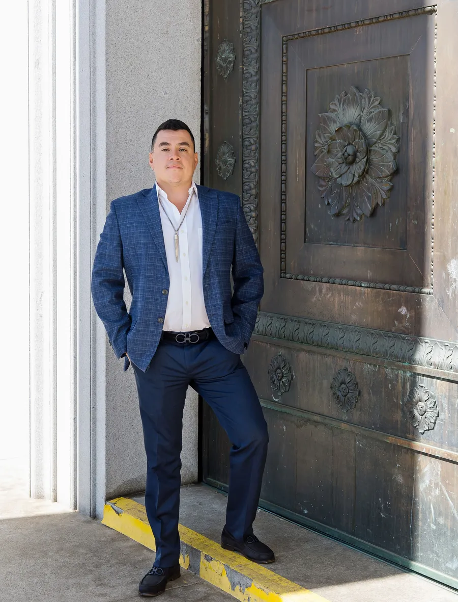 Alfredo Reyes at the entrance of the Denver City & County Building